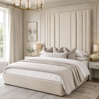 Luxury beige upholstered bed with tall panel headboard, styled in elegant neutral bedroom with soft lighting