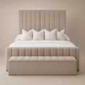 Luxury beige upholstered bed with tufted headboard and matching storage bench, styled with white linens