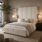 Luxury upholstered bed with tufted headboard in neutral tones, styled with plush bedding and bedside lamps