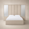 Luxury beige upholstered bed with mirrored panels and white linens, modern bedroom furniture