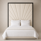 Luxury bed with cream sunburst headboard, white linens, and black frame for modern bedroom
