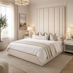 Luxury upholstered bed with tall panel headboard, white bedding, and bedside lamps in elegant bedroom