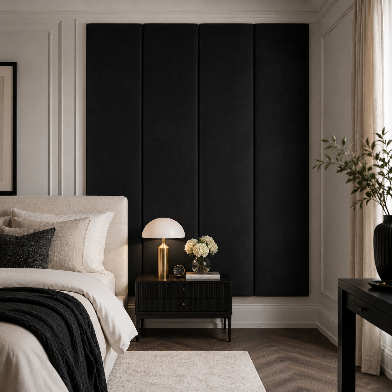 Luxury bedroom with black upholstered headboard, modern nightstand, and ambient lighting for elegant home decor.