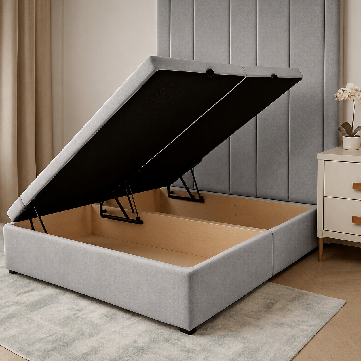 Grey upholstered storage bed frame with lift-up mechanism and wooden base, ideal for luxury bedrooms.