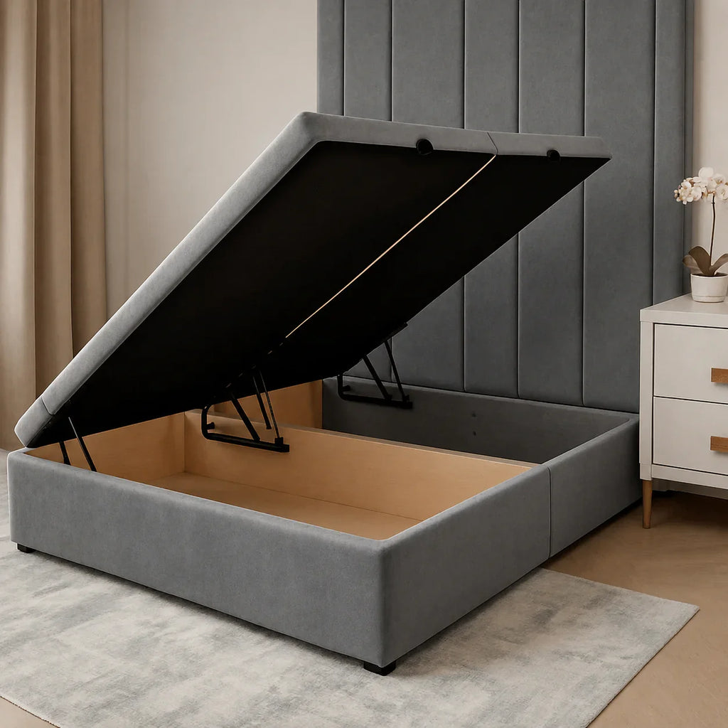 Grey upholstered storage bed with lift-up mechanism, showing spacious wooden interior, ideal for luxury bedrooms.