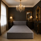 Luxury grey upholstered bed frame in elegant bedroom with chandelier and ornate mirrors
