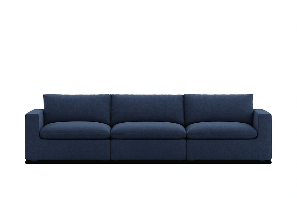 Modern navy blue three-seater sofa with plush cushions and square arms on white background