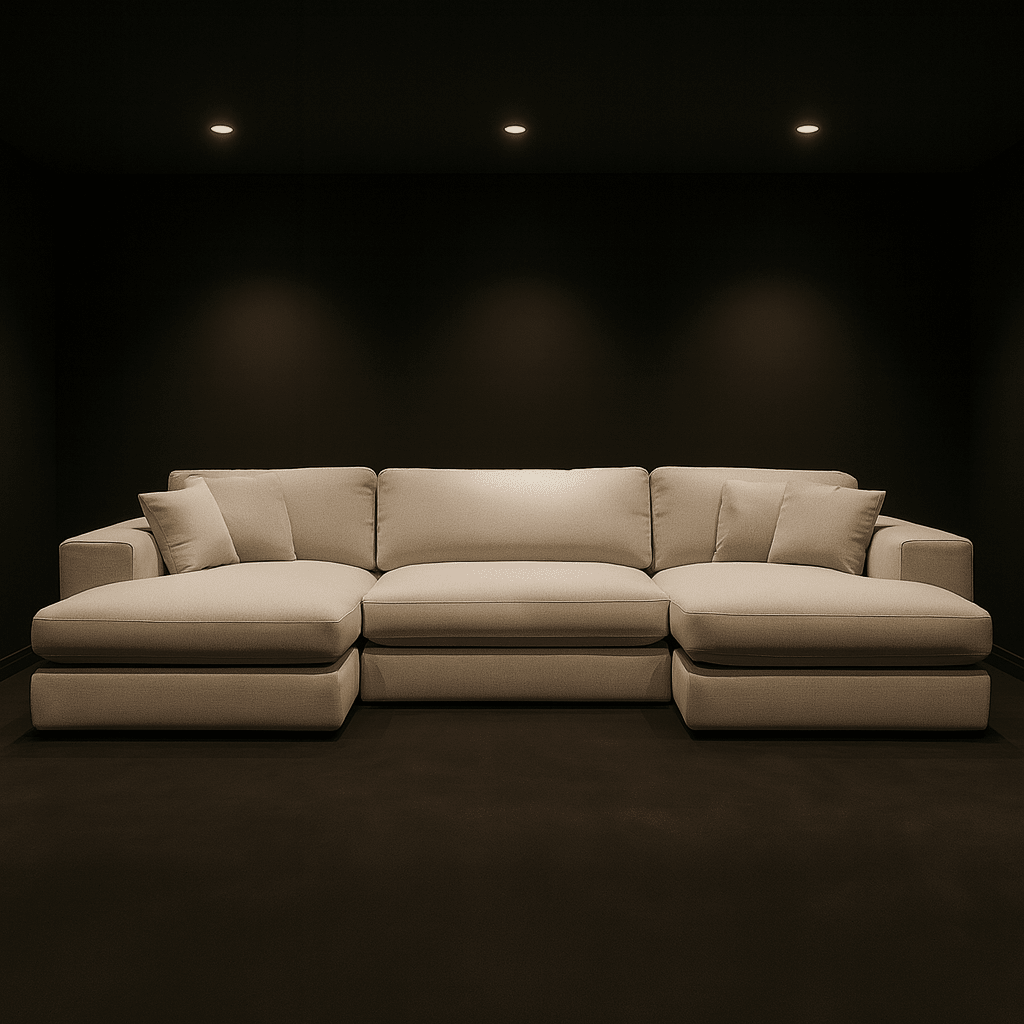 Modern beige sectional sofa with chaise lounge in a dark, minimalist living room