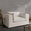 Modern white textured sofa with plush cushions against brick wall, luxury living room furniture