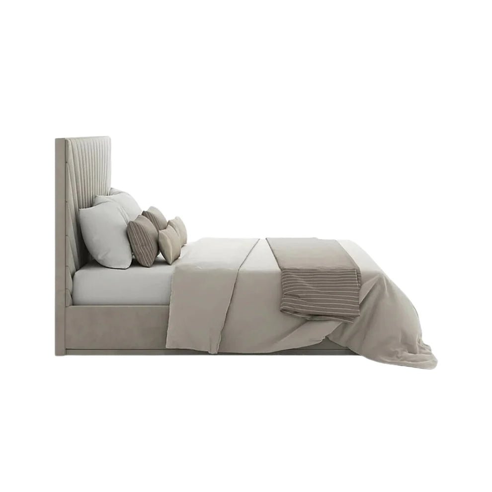 Modern upholstered bed with high headboard, neutral bedding, and decorative pillows