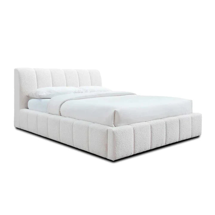 Modern white upholstered bed with tufted headboard and low profile frame