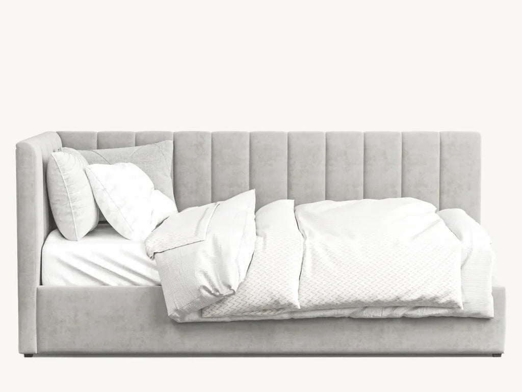 Modern grey upholstered bed with plush, vertical-stitched headboard and white bedding