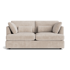 Modern beige fabric sofa with plush cushions, minimalist design, isolated on white background