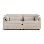 Modern beige fabric sofa with plush cushions and low arms, perfect for living room decor