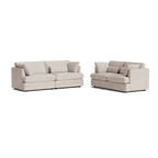 Set of two modern beige fabric sofas with plush cushions and contemporary design