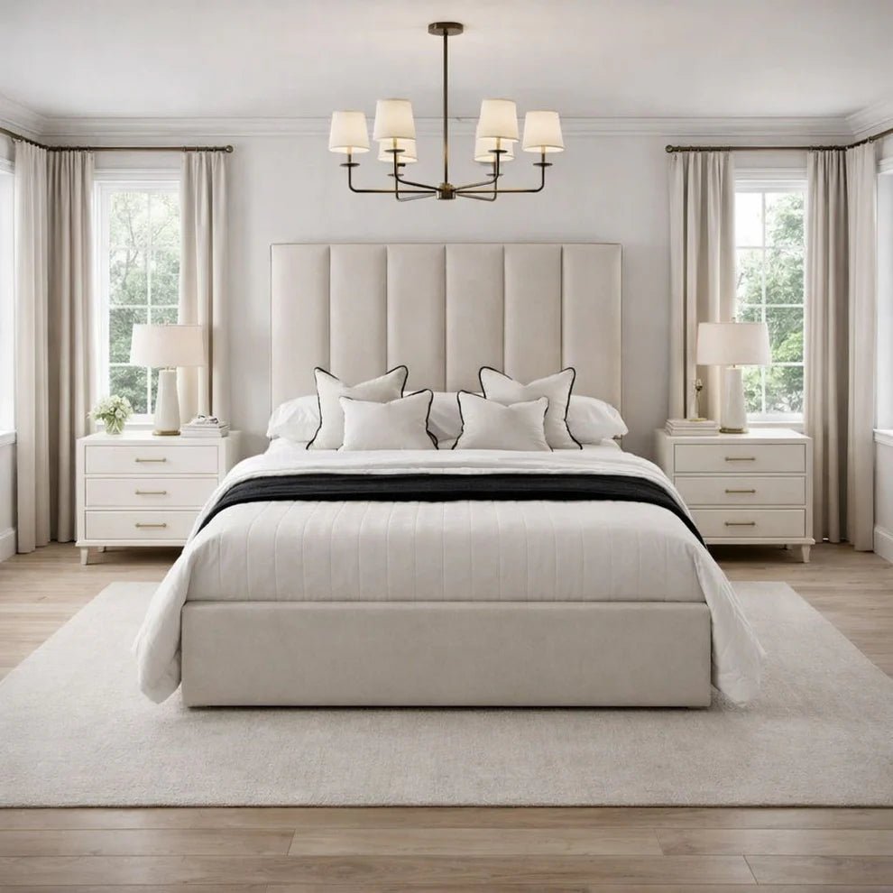 Luxury upholstered bed with tall headboard, white bedding, and modern bedroom decor