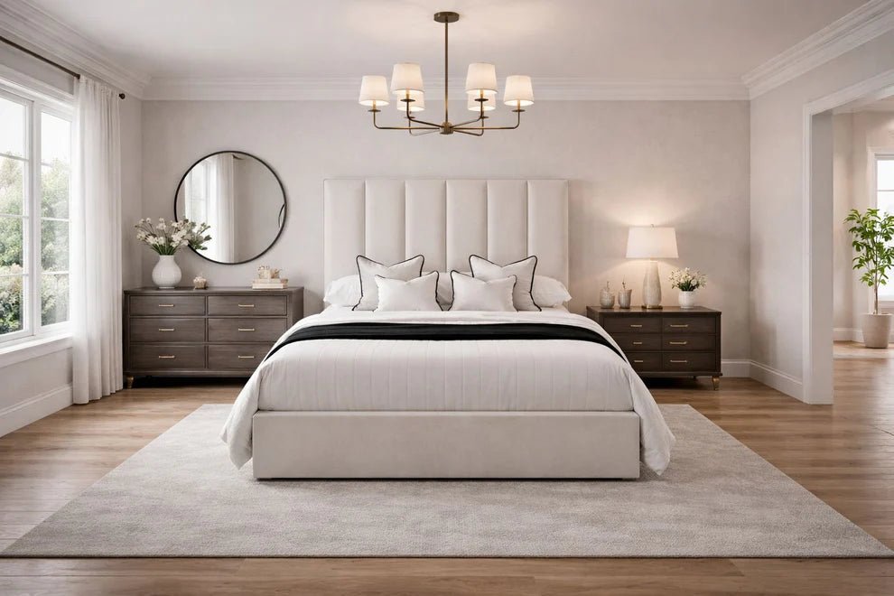 Modern luxury bedroom with upholstered bed, large headboard, elegant decor, and wood flooring