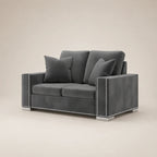Grey velvet two-seater sofa with nailhead trim and matching cushions, modern luxury living room furniture