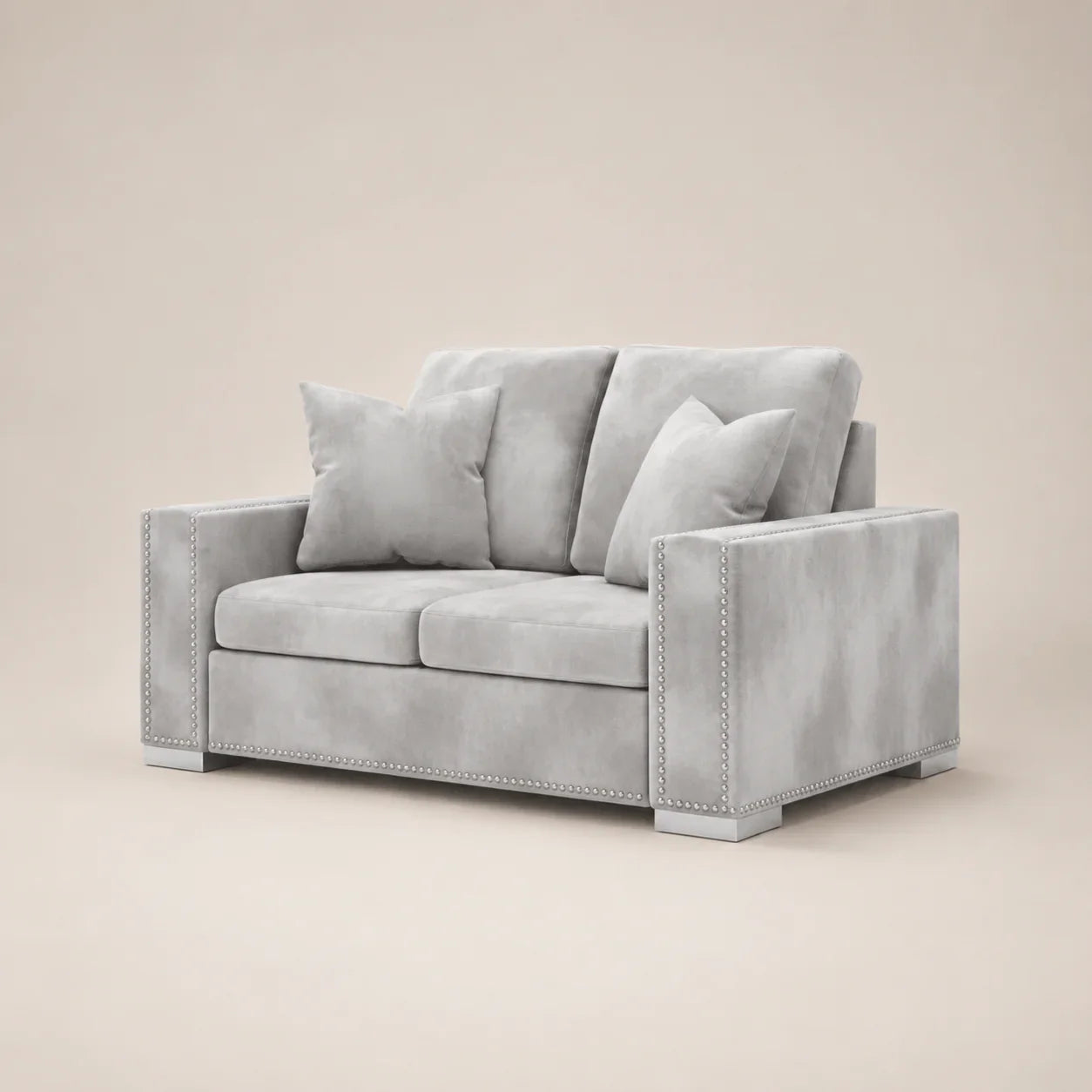 Luxury gray velvet two-seater sofa with nailhead trim and matching cushions, ideal for modern living rooms.