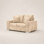 Beige velvet two-seater sofa with nailhead trim and matching cushions, modern luxury living room furniture