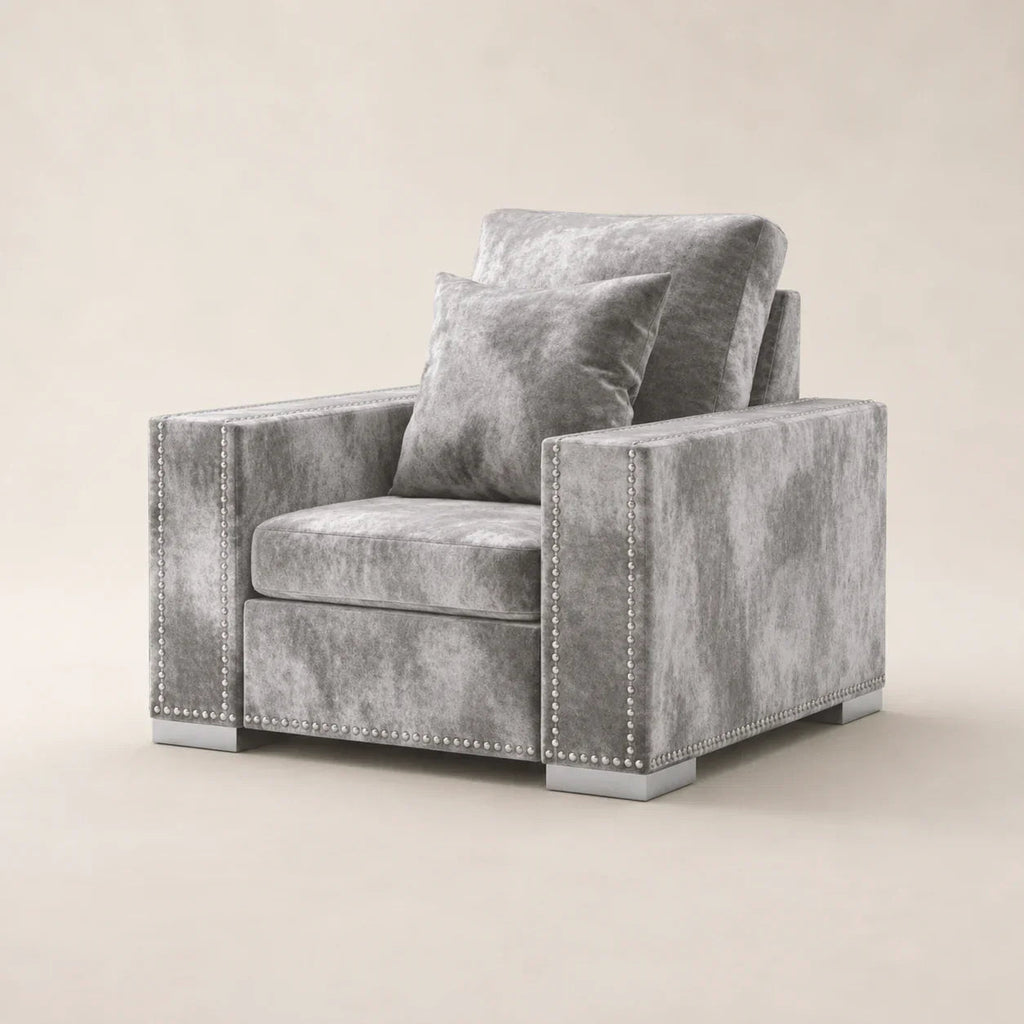 Luxury gray velvet armchair with nailhead trim and matching pillow, modern living room furniture