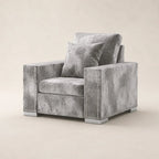 Luxury gray velvet armchair with nailhead trim and matching pillow, modern living room furniture