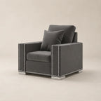 Grey velvet armchair with silver nailhead trim and matching cushions, modern luxury living room furniture