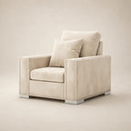 Cream velvet armchair with nailhead trim and matching pillow, luxury living room furniture