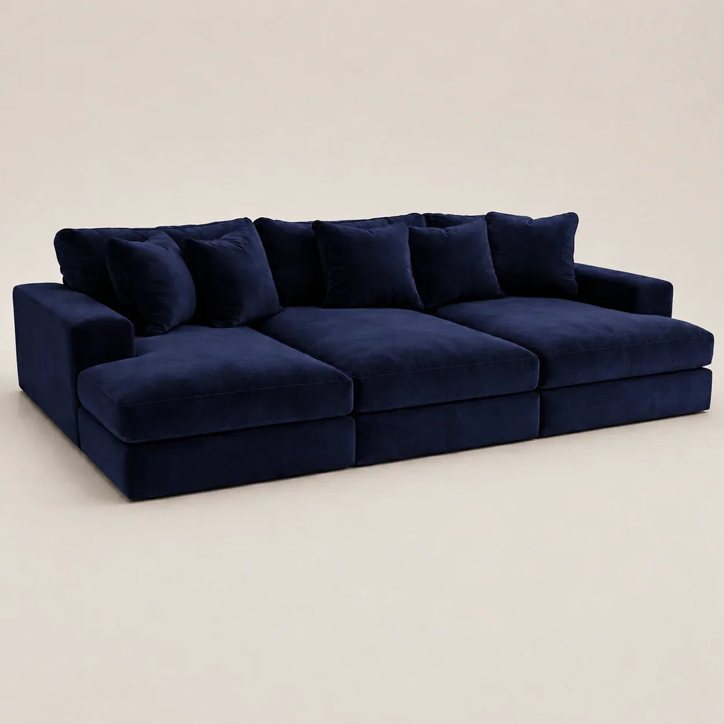 Luxury navy blue velvet sectional sofa with plush cushions, ideal for modern living rooms