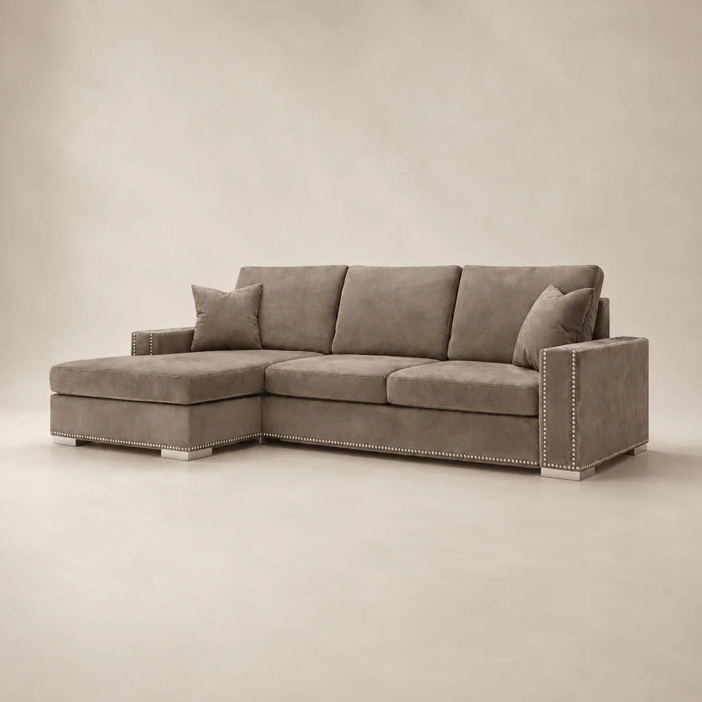 Luxury grey sectional sofa with chaise and nailhead trim, perfect for modern living rooms