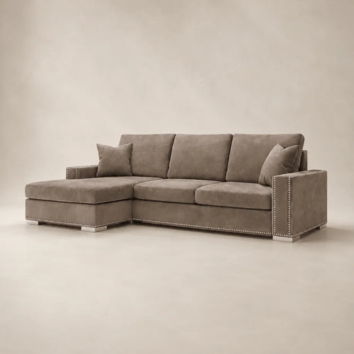 Luxury grey sectional sofa with chaise and nailhead trim, perfect for modern living rooms