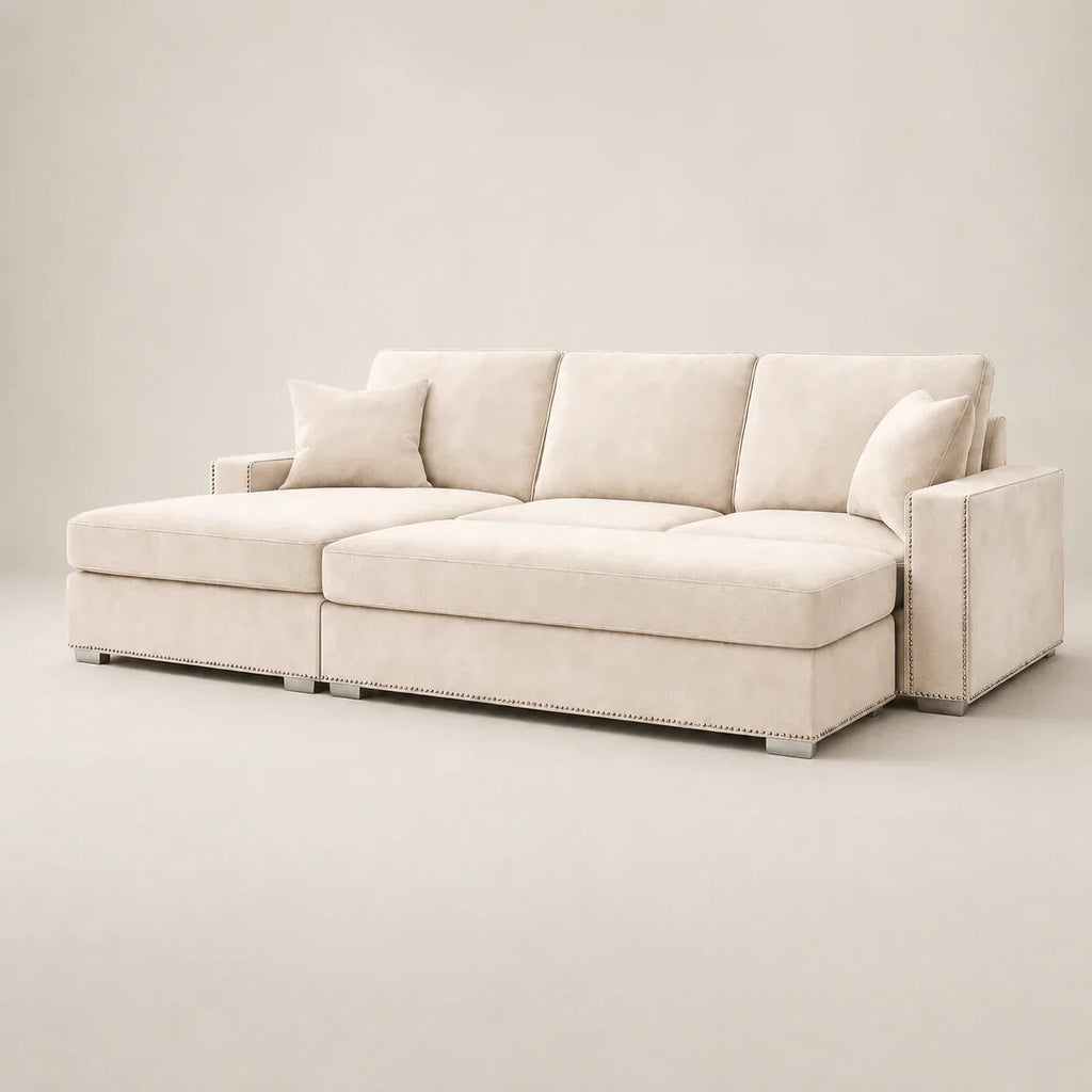 Luxury beige sectional sofa with chaise, nailhead trim, and plush cushions for modern living rooms