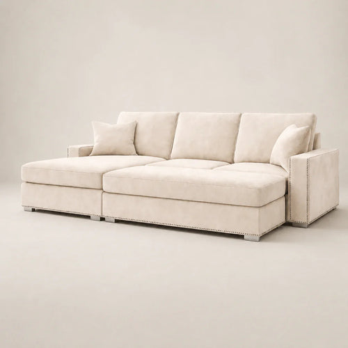 Luxury beige sectional sofa with chaise, nailhead trim, and plush cushions for modern living rooms