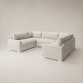 Modern L-shaped sectional sofa in light grey fabric, ideal for luxury living rooms