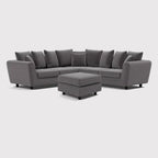 Grey double corner sofa with footstool and scatter cushions on white background