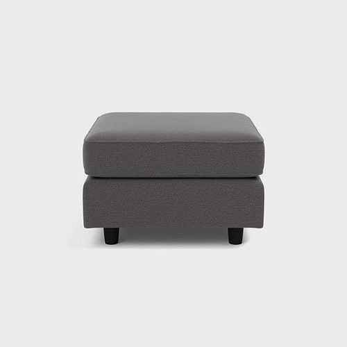 Modern grey fabric footstool with black legs on white background
