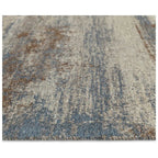 Blue and beige vintage-style area rug with distressed pattern and textured weave
