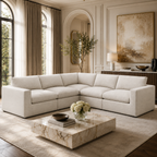 Luxury beige sectional sofa in elegant living room with marble coffee table and arched windows