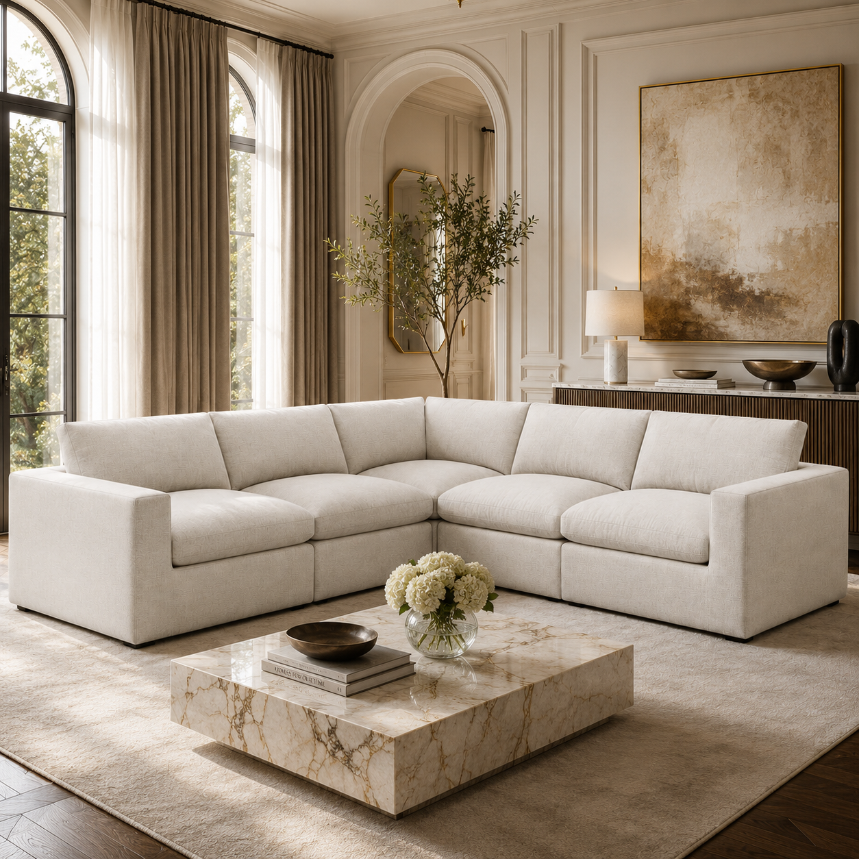 Luxury beige sectional sofa in elegant living room with marble coffee table and arched windows