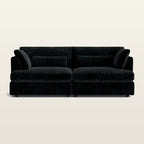 Luxury black velvet sofa with plush cushions, modern design for contemporary living rooms