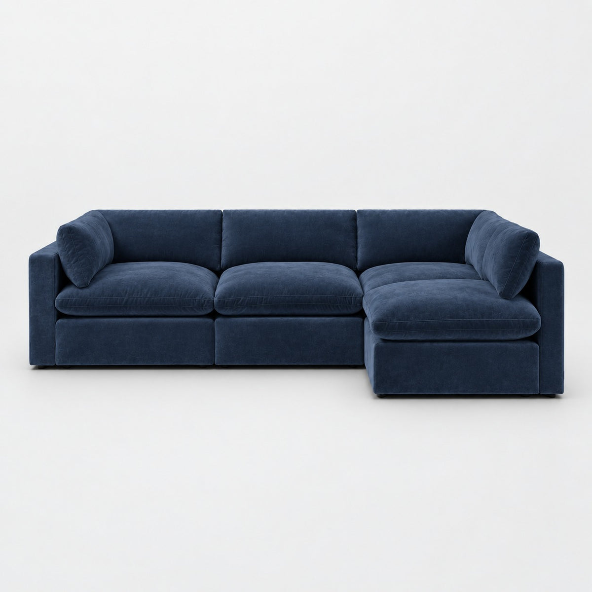 Bellano L-Shape Sofa — Plush Velvet / Pacific / Pillow — Extra-soft fibre & feather — plain background