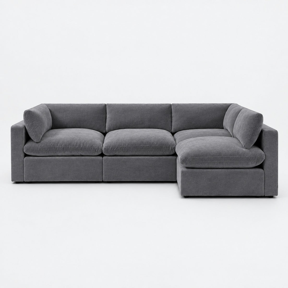Bellano L-Shape Sofa — Plush Velvet / Smoked Steel / Pillow — Extra-soft fibre & feather — plain background