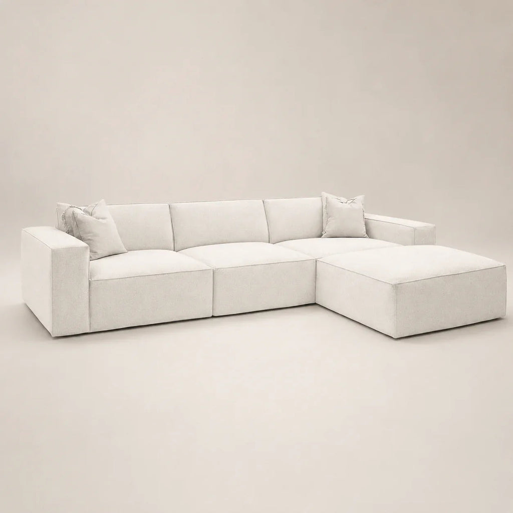 Luxury white sectional sofa with chaise and plush cushions, modern minimalist design