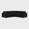 Modern black double corner sofa with clean lines and plush cushions on a light background