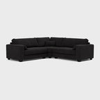 Modern black double corner sofa with clean lines and plush cushions on a light background