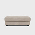 Beige upholstered footstool with soft cushion and dark wooden legs, modern living room furniture