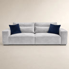 Luxury gray velvet sofa with navy blue cushions, modern design for living room comfort