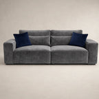 Gray velvet sofa with navy blue cushions, modern luxury living room furniture