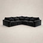 Black velvet L-shaped sectional sofa with plush cushions, modern luxury living room furniture