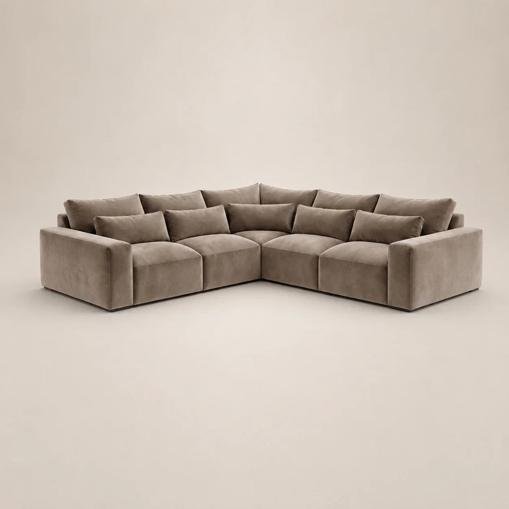 Luxury L-shaped sectional sofa in soft grey velvet, perfect for modern living rooms